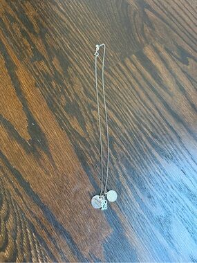 Silver tone charm necklace